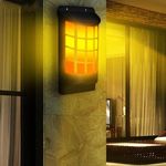 Hangulatos láng hatású napelemes fali lámpa, dekoráció fotó