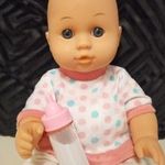 Tündéri kis csecsemő baba varázscumisüveggel 32 cm fotó