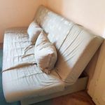 halványzöld, mintás, ággyá alakítható kanapé eladó fotó