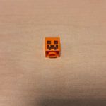 LEGO 19729pb001 Orange Minifigure, Head (Minecraft Pumpkin Jack O' Lantern / Snow Golem) fotó