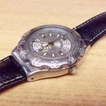 Svájci SWATCH Quartz karóra Króm tokozású forgó lünettás, bőr szíjjal fotó