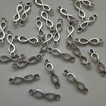 Fém medál, összekötő (íves) - 5x20mm - végtelen jel - 10 db / csomag - antik ezüst szín fotó