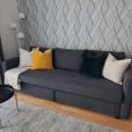 Újszerű IKEA FRIHETEN 3 személyes, kinyitható, ágyneműtartós kanapé, Hyllie sötétszürke huzattal fotó