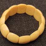 Sárga gumis karkötő (K) fotó