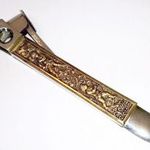 Donatus Solingen. Rozsdamentes acél vintage német szivarvágó. Barokk stílusú bronz dekorációval fotó