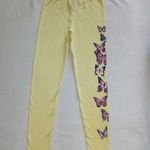 AKCIÓ!!! 122 Szép citromsárga színű, pillangó mintás lányka pamut leggings fotó