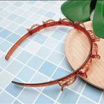 Hajpánt, csatos hajráf, hajrögzítő csatokkal - barna fotó