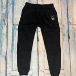 Fekete, oldalán zsebes, fenekén szemes és kicipzározható szájas-fogas nadrág, melegítő. 158 13 év Vi fotó